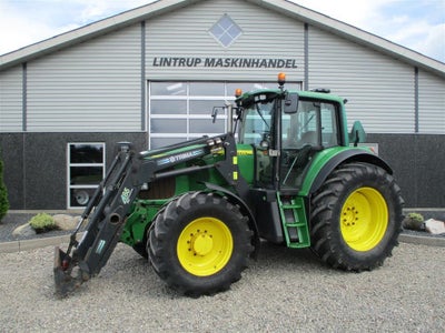 6920 AutoPower med fuldhydraulisk Trima frontlæsser og frontlift John Deere